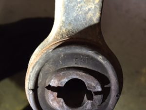 Worn lower control arm